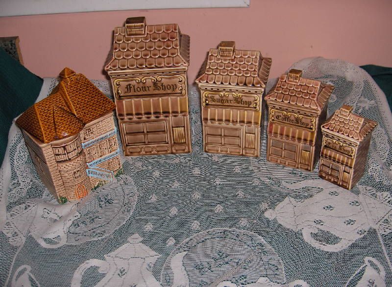 up for sale is a beautiful 8 piece village set of ceramic