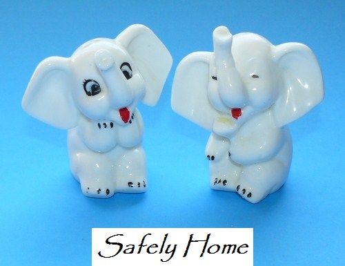 Vintage sweet white elephants salt and pepper shakers. Marked Japan 